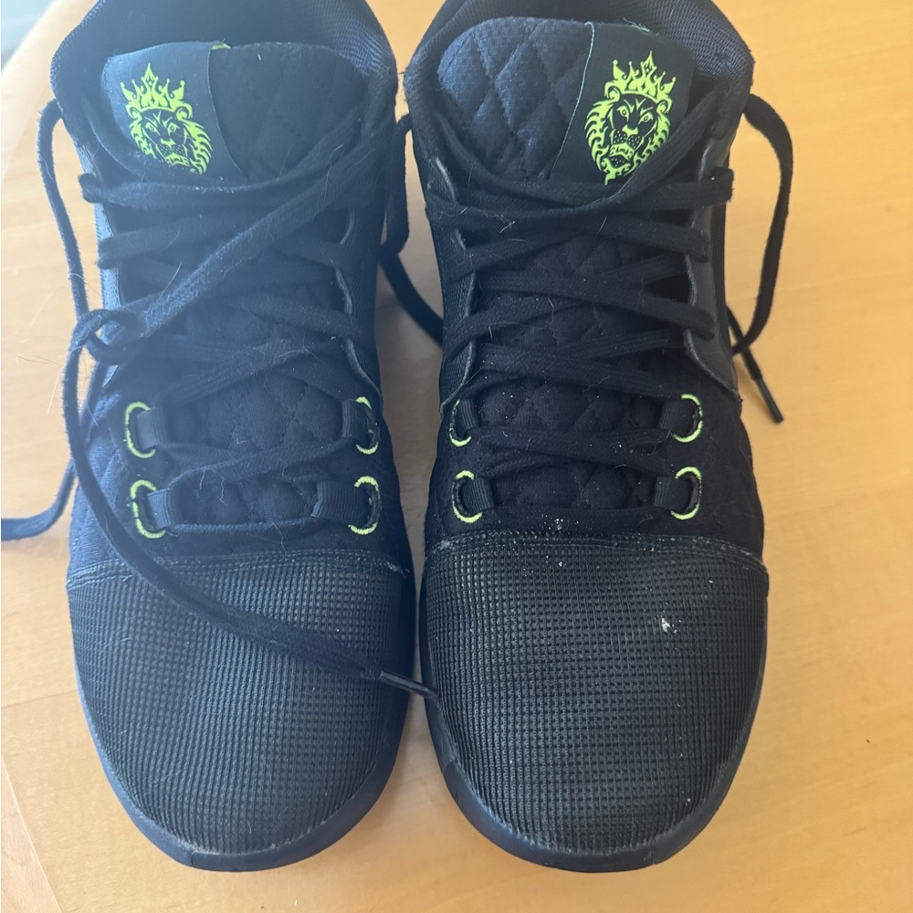 LeBron’s  black High-Top Sneakers with Green Accents